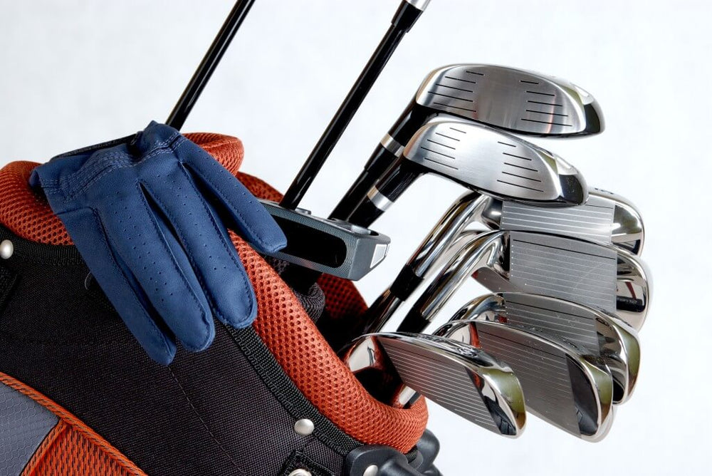 Golf clubs and glove in a golf bag